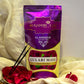 Front of Gulabi Maya Agarbatti Pouch surrounded by petals