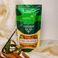Pure Chandan Agarbatti Pouch placed on table surrounded by chandan sticks and leaves