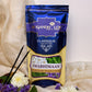 Front of Swabhimaan Agarbatti Pouch placed on a table surrounded by flowers
