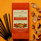 Pure Chandan Agarbatti Mini Sticks Pack surrounded by chandan