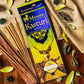 Mysore Kasturi Agarbatti Pack on a table surrounded by Kasturi