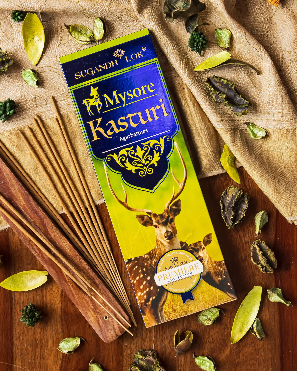 Mysore Kasturi Agarbatti Pack on a table surrounded by Kasturi