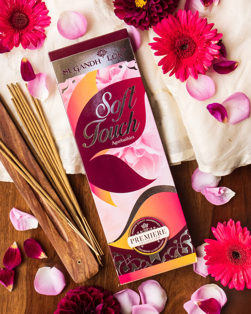 Soft Touch Agarbatti Pack surrounded by petals and flowers