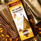 Sri Sai Sugandh Agarbatti Pack placed on a table surrounded by petals