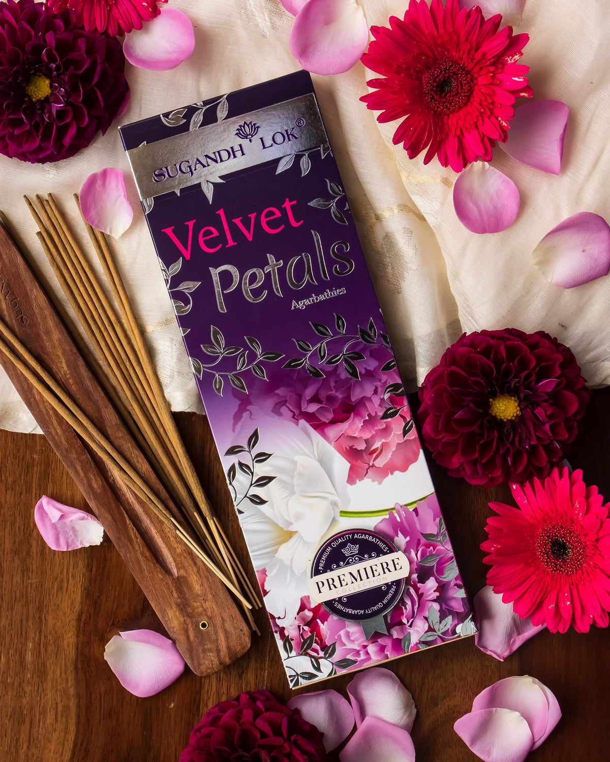 Velvet Petals Agarbatti Pack surrounded by flowers and Petals