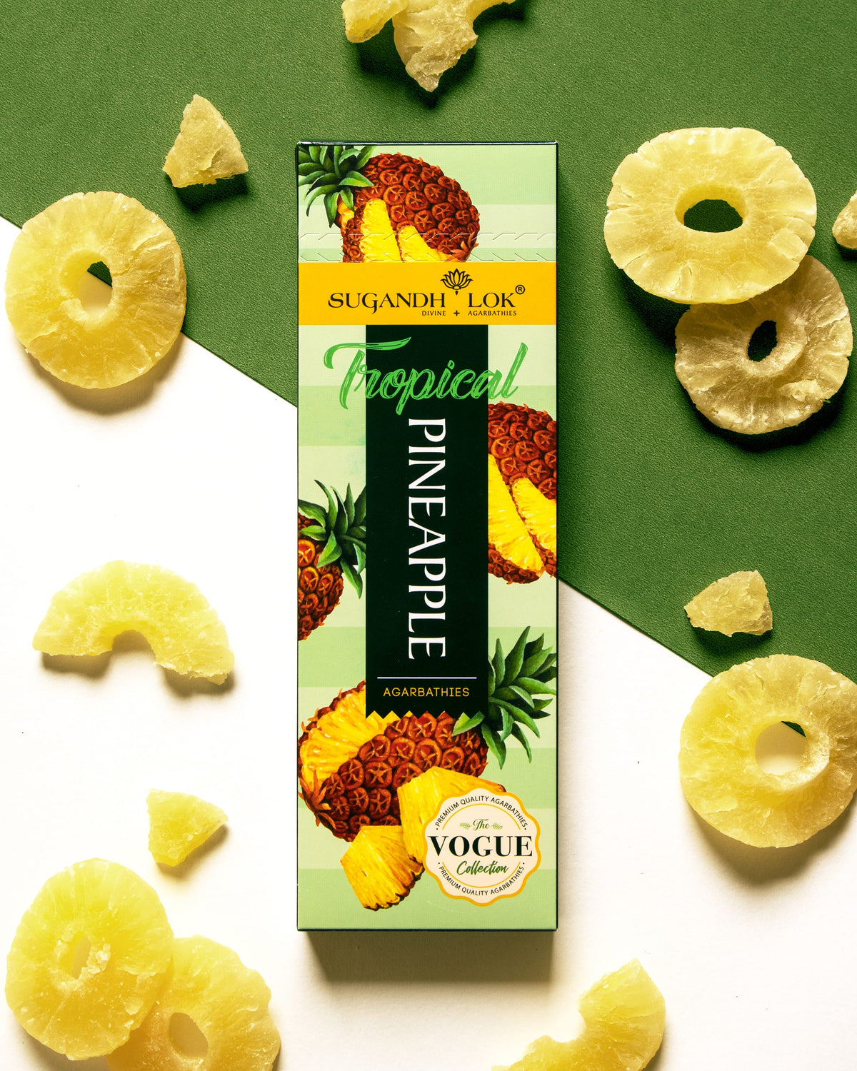 Tropical Pineapple Agarbatti Pack surrounded by pineapple pieces